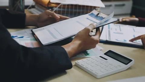 Anonymous hands of an accountant working with documents Stock Footage 333274952