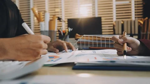 Anonymous hands of an accountant working with documents Stock Footage 333274956