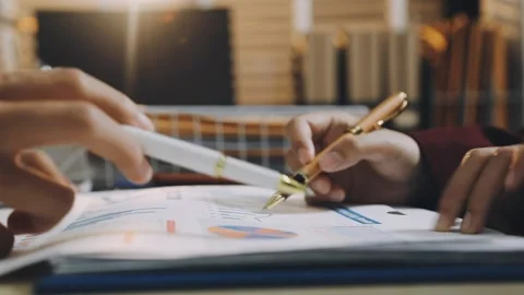 Anonymous hands of an accountant working with documents Stock Footage 333274959