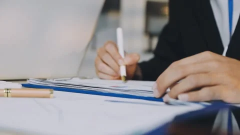 Anonymous hands of an accountant working with documents Stock Footage 333274965