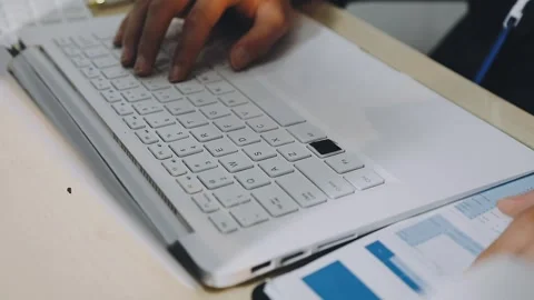 Anonymous hands of an accountant working with documents Stock Footage 333274966