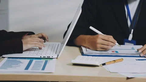 Anonymous hands of an accountant working with documents Stock Footage 333274969