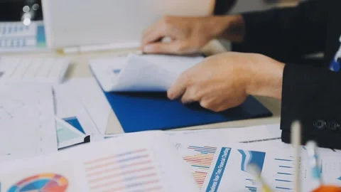 Anonymous hands of an accountant working with documents Stock Footage 333274979