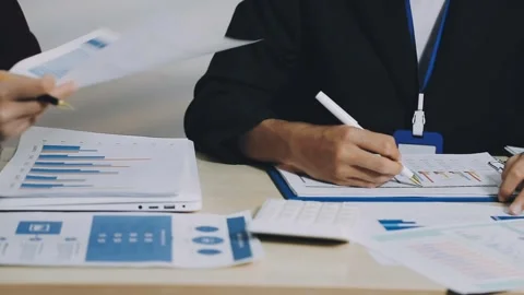 Anonymous hands of an accountant working with documents Stock Footage 333274983