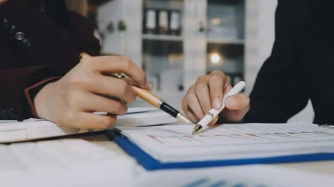Anonymous hands of an accountant working with documents Stock Footage 333274997