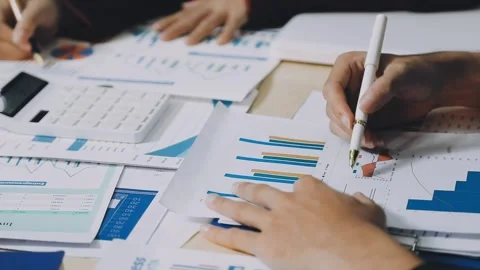 Anonymous hands of an accountant working with documents Stock Footage 333275019