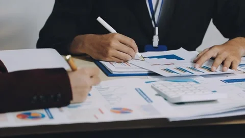 Anonymous hands of an accountant working with documents Stock Footage 333275021