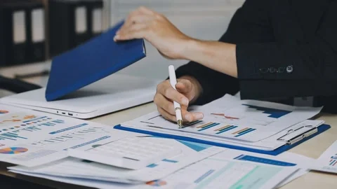 Anonymous hands of an accountant working with documents Stock Footage 333275028