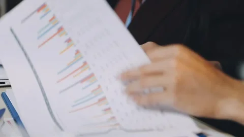 Anonymous hands of an accountant working with documents Stock Footage 333275077