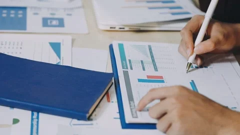 Anonymous hands of an accountant working with documents Stock Footage 333275078