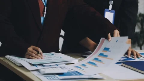 Anonymous hands of an accountant working with documents Stock Footage 333275134