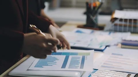 Anonymous hands of an accountant working with documents Stock Footage 333275145