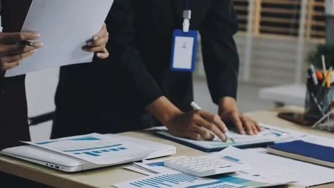 Anonymous hands of an accountant working with documents Stock Footage 333275175