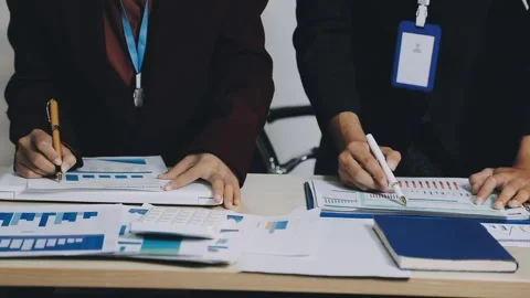 Anonymous hands of an accountant working with documents Stock Footage 333275186