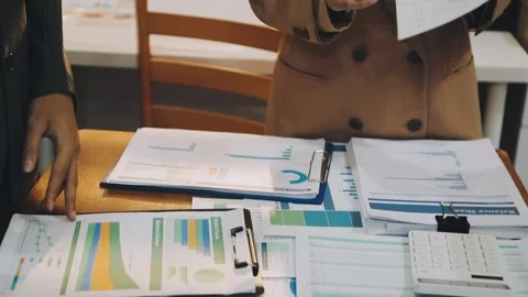 Anonymous hands of an accountant working with documents Stock Footage 333275267