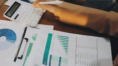 Anonymous hands of an accountant working with documents Stock Footage 333275306