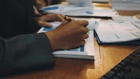Anonymous hands of an accountant working with documents Stock Footage 333275317