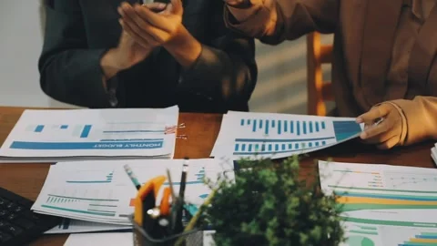 Anonymous hands of an accountant working with documents Stock Footage 333275326