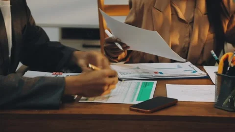 Anonymous hands of an accountant working with documents Stock Footage 333275337