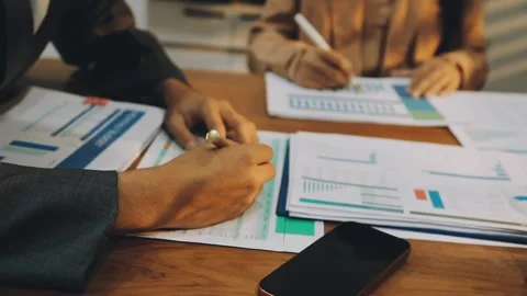 Anonymous hands of an accountant working with documents Stock Footage 333275347
