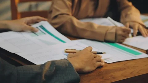 Anonymous hands of an accountant working with documents Stock Footage 333275362