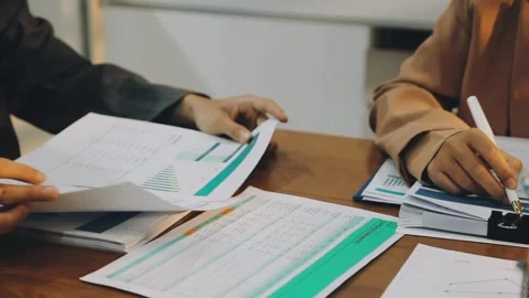 Anonymous hands of an accountant working with documents Stock Footage 333275367