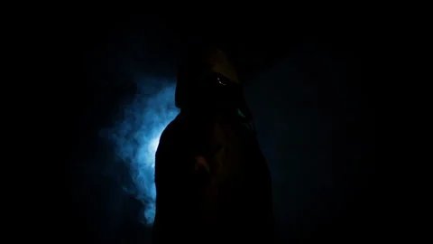 Anonymous Hooded Man Aiming and Firing Gun in Dark Smoke, Crime Threat Concept Stock Footage 332495769