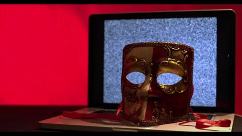 Anonymous Identity Concept with Venetian Mask Covering Laptop Computer Stock Footage 331925838
