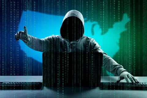 Anonymous internet hacker in front of computer. Web crime concept Stock Photos