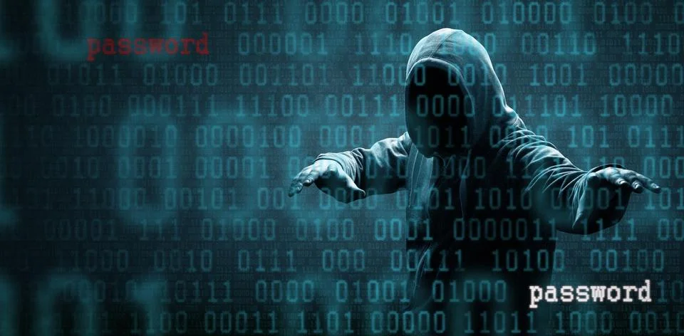 Anonymous internet hacker in front of computer. Web crime concept Stock Photos