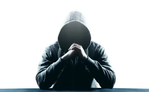 Anonymous internet hacker in front of computer. Web crime concept Stock Photos