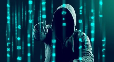 Anonymous internet hacker in front of computer. Web crime concept Stock Photos