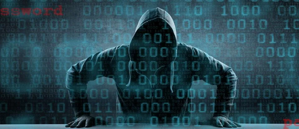 Anonymous internet hacker in front of computer. Web crime concept Stock Photos