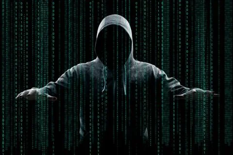 Anonymous internet hacker in front of computer. Web crime concept Stock Photos