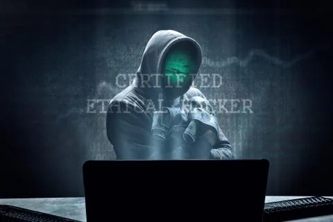 Anonymous internet hacker in front of computer. Web crime concept Stock Photos