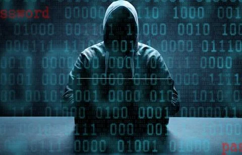 Anonymous internet hacker in front of computer. Web crime concept Stock Photos
