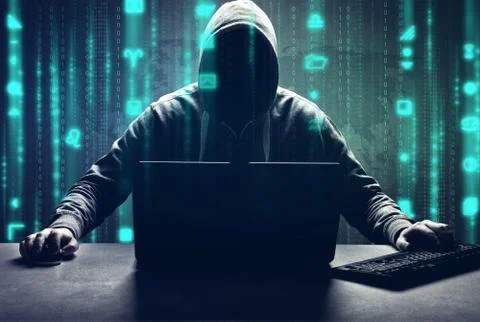 Anonymous internet hacker in front of computer. Web crime concept Stock Photos