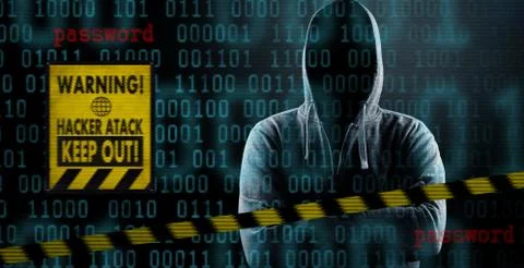 Anonymous internet hacker in front of computer. Web crime concept Stock Photos