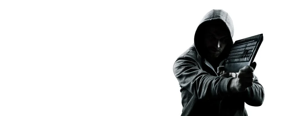 Anonymous internet hacker in front of computer. Web crime concept Stock Photos