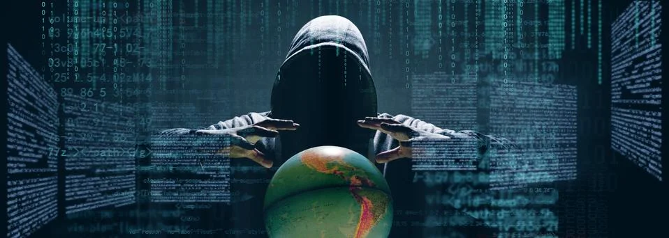 Anonymous internet hacker in front of computer. Web crime concept Stock Photos