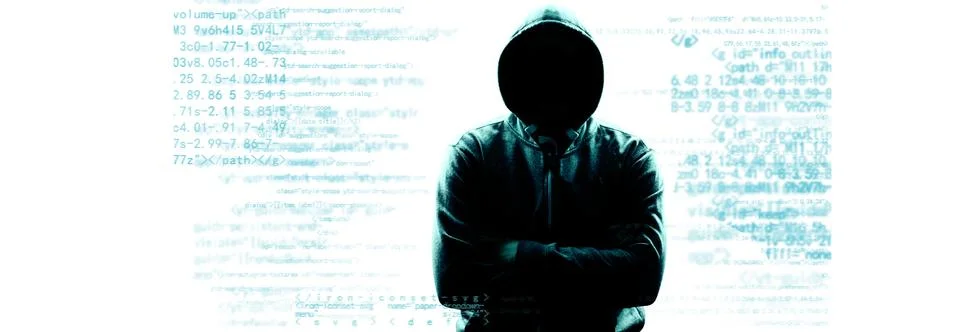 Anonymous internet hacker in front of computer. Web crime concept Stock Photos