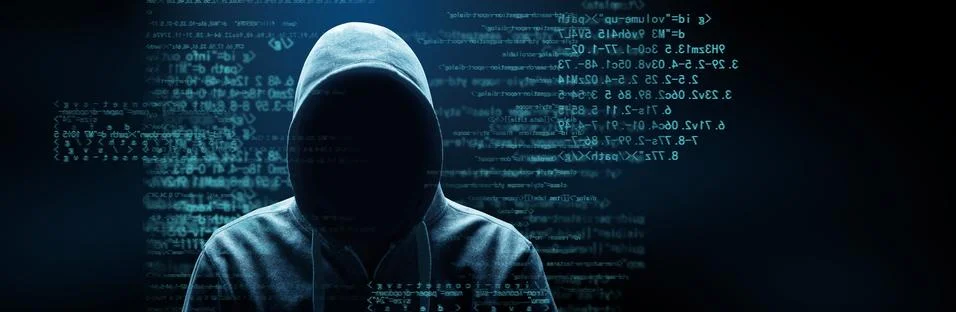 Anonymous internet hacker in front of computer. Web crime concept Stock Photos