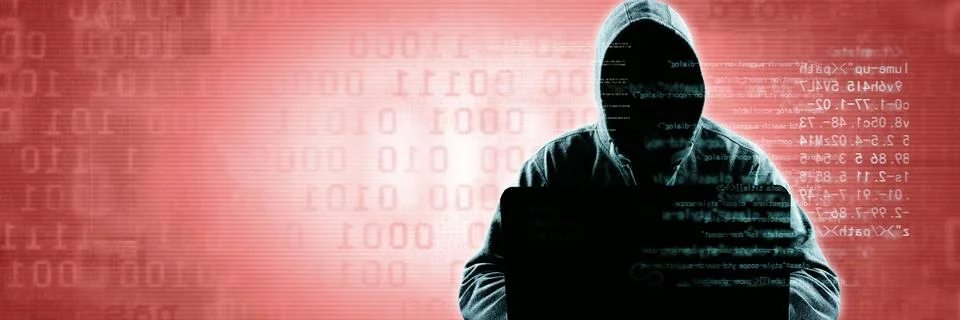Anonymous internet hacker in front of computer. Web crime concept Stock Photos