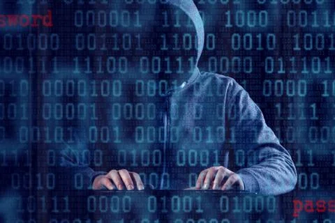 Anonymous internet hacker in front of computer. Web crime concept Stock Photos