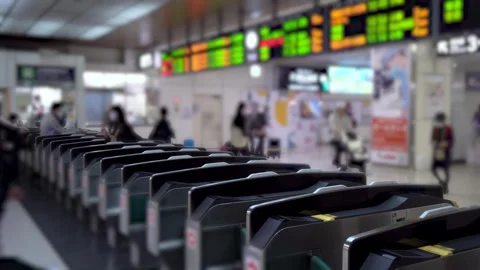 Anonymous Japanese Commuters Enter Through Ticket Gates at Tokyo Train Station Stock Footage 268842667