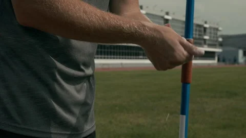Anonymous Javelin Thrower with Limb Difference Sprinkling Hands with Chalk Video stock 297944618