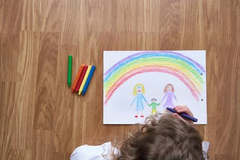 Anonymous kid drawing in daytime Stock Photos