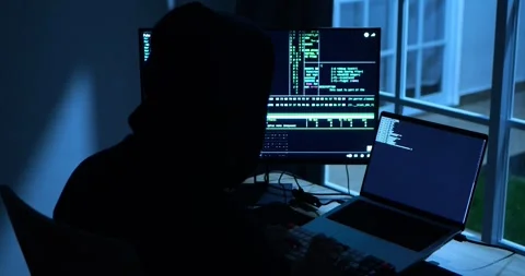 Anonymous Male Hacker Breaks into Data Servers, DDOS Attack, Phishing Attack. Stockbeeldmateriaal 279867715