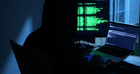 Anonymous Male Hacker Breaks into Data Servers, DDOS Attack, Phishing Attack. 库存影片 279868689