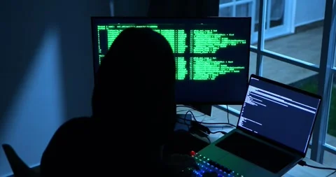 Anonymous Male Hacker Breaks into Data Servers, DDOS Attack, Phishing Attack. 库存影片 279868867